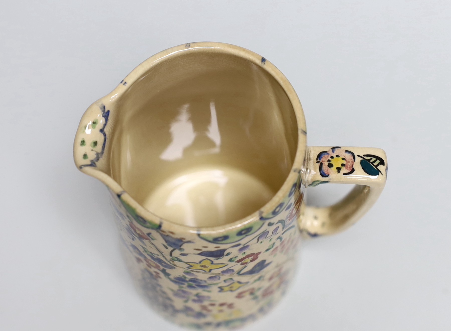 Jessie Marion King (1875-1949), a covered floral jug, 18.5cm
